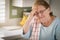 Sad Crying Senior Adult Woman At Kitchen Sink