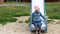 Sad and dissatisfied child girl on the playground expresses dissatisfaction