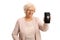 Sad elderly woman holding a mobile phone with a broken screen