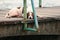 Sad face dog laid down over a wooden bridge