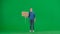 A sad female activist holds a blank sign on a green screen. Chroma key, advertisement, promo.