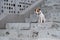 Sad frightened lost dog jack russell terrier sitting on the stairs alone outdoors