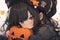 sad girl with black hair holding carved pumpkin for halloween in anime style