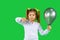 Sad girl with blonde ponytails and ultimate gray balloon points thumb down. Unlike on a green background