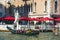 Sad gondolier with cheerful tourists on the Grand Canal, Venice