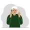 Sad grandfather talking on a cell phone with emotions. One hand with the phone the other with a forefinger up gesture.