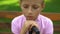 Sad little boy sitting alone, frustrated about bullying at school, has no friend