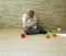 Sad little boy with teddy bear sitting sadness depressed on the floor