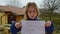 Sad little caucasian girl holding poster with inscription Everything will be ok