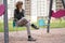 Sad lonely teenager outdoor on the Playground. the difficulties of adolescence in communication concept.