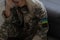 sad military ukrainian woman in uniform