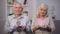 Sad old couple counting pension benefit, social insecurity, lack of money