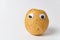 Sad raw potatoes with Googly eyes on white background. Food with funny face