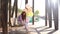 Sad redhead young woman swaying on swing holding hands large fountain of colorful balloons.