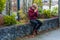 Sad teen boy praying outdoor in city park for future feeling nervous