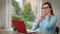 Sad tired mature woman stretching painful neck sitting at table with laptop. Portrait of upset Caucasian businesswoman