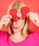 Sad woman with cut paper heart. Girl with heartbreak. Valentines day. Broken heart. Unhappy love.