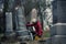 Sad Woman in Mourning Touching a loved one\'s Gravestone