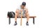 Sad young baseball player sitting on a bench
