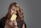 Sad young beautiful woman eating white chocolate.