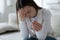 Sad young woman hold wedding ring distressed with breakup