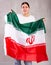 Sad young woman holding Iran flag against unicoloured background