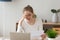 Sad young woman reading bad news in paper letter