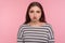 Sadness, negative emotions. Portrait of unhappy depressed young woman in striped sweatshirt looking disappointed