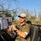 Safari Guide Ranger instructing guests about animals in a wildlife reserve