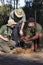 Safari Guide with tourists and elephant dung