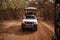 Safari Jeep with tourists going away forward on sandy road. Wild life in Safari. Baobab and bush jungles in Senegal, Africa.
