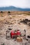 Safari outdoor picnic with African Tanzanian cuisine with baked Chapati nan flatbread on red table