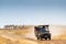 Safari Tourists on Game Drive With Zebra