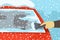 Safe car driving rules and tips. Winter season driving. Close-up of a hand cleaning a vehicle`s windshield from ice and snow.