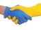 Safe contact. Two people shaking hands in rubber protective blue and yellow gloves, close up, isolated on white.