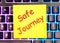 Safe journey text written on a yellow sticker lies on a glowing keyboardbusiness