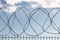 Safe protective metal fence with barbed wire