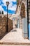 Safed Old Town street, bystreet, alley, backstreet with lantern, benches, ancient stone walls, arcs and blue white decorations