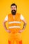 Safety apparel for construction industry. Bearded brutal hipster safety engineer. High visibility reflective safety vest