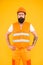 Safety apparel for construction industry. Bearded brutal hipster safety engineer. Man engineer protective uniform orange