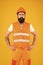 Safety apparel for construction industry. Bearded brutal hipster safety engineer. Man engineer protective uniform orange