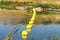 Safety buoys strung across a small stream
