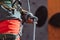 Safety climbing. Young man professional rock climber checking sports equipment before climbing at training center in