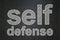Safety concept: Self Defense on chalkboard background