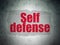 Safety concept: Self Defense on Digital Data Paper background