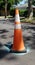 Safety cone placed over pothole