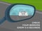 Safety driving and traffic rules. Close-up view of a vehicle wing mirror. Back view. Check your mirrors every 5-8 seconds.