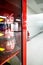 Safety equipment cabinet filled with helmets in public area building