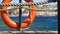 Safety equipment, Life buoy or rescue buoy on the wooden pier at the beach