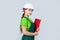 Safety expert. kid wear helmet on construction site. teen girl builder with building paper document. child on repairing